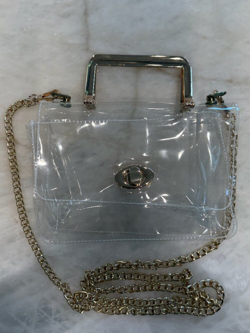 Clear vinyl festival/concert/stadium clutch with gold-tone clasp and strap
